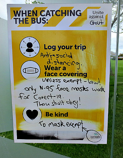 Bus shelter poster defaced